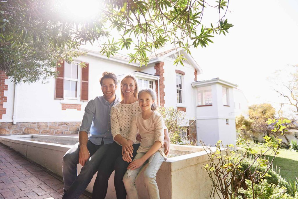 median home price in los altos family sitting outside their home.